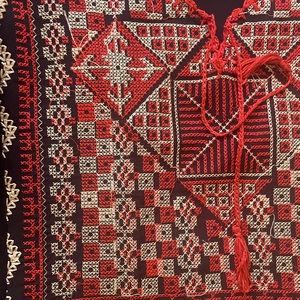 Red&black,manufactured,medium,thread patterns originated by Palestinian artist